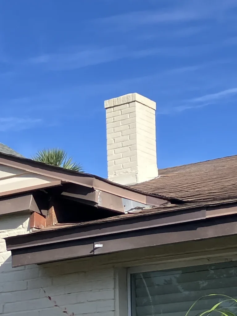 Residential brick chimney scheduled for removal prior to demolition work