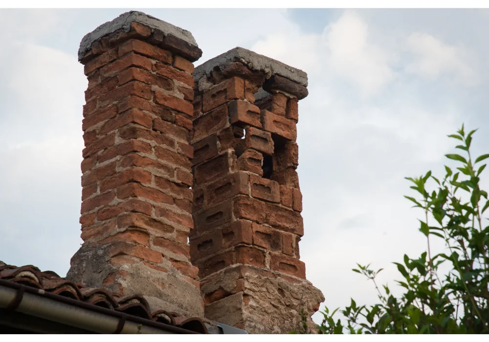 Example of a deteriorated brick chimney showing masonry damage and separation